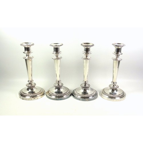 130 - Set of 4 Regency Old Sheffield Plate candlesticks, each with a campana shaped capital, gadrooned dec... 