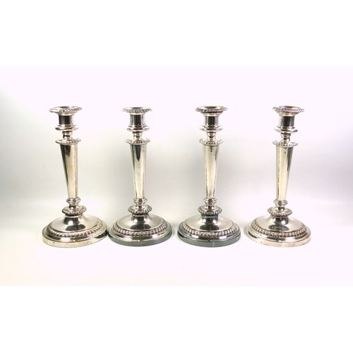 130 - Set of 4 Regency Old Sheffield Plate candlesticks, each with a campana shaped capital, gadrooned dec... 