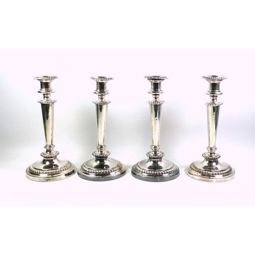 130 - Set of 4 Regency Old Sheffield Plate candlesticks, each with a campana shaped capital, gadrooned dec... 