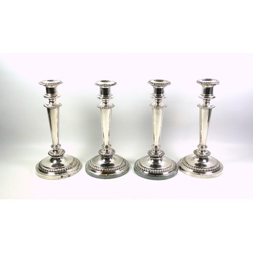 130 - Set of 4 Regency Old Sheffield Plate candlesticks, each with a campana shaped capital, gadrooned dec... 