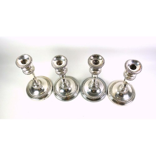 130 - Set of 4 Regency Old Sheffield Plate candlesticks, each with a campana shaped capital, gadrooned dec... 