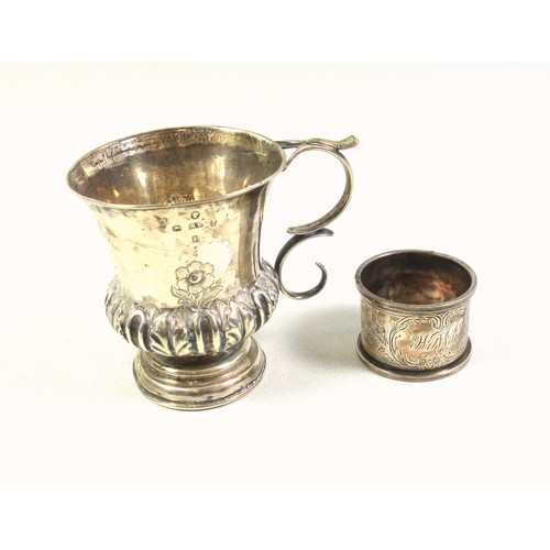 131 - Victorian silver campana shaped christening mug with twin scroll handle, chased and embossed floral ... 