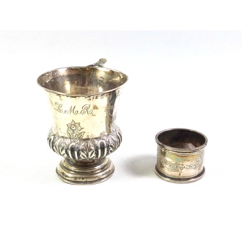 131 - Victorian silver campana shaped christening mug with twin scroll handle, chased and embossed floral ... 