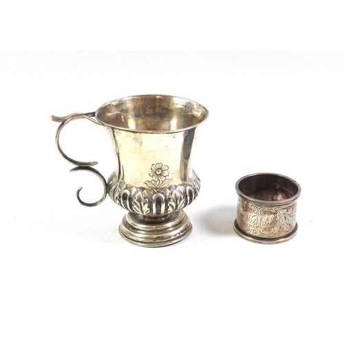 131 - Victorian silver campana shaped christening mug with twin scroll handle, chased and embossed floral ... 