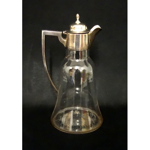 134 - Edwardian silver mounted glass claret jug, of campana form with a star cut base, Birmingham, 1907, (... 