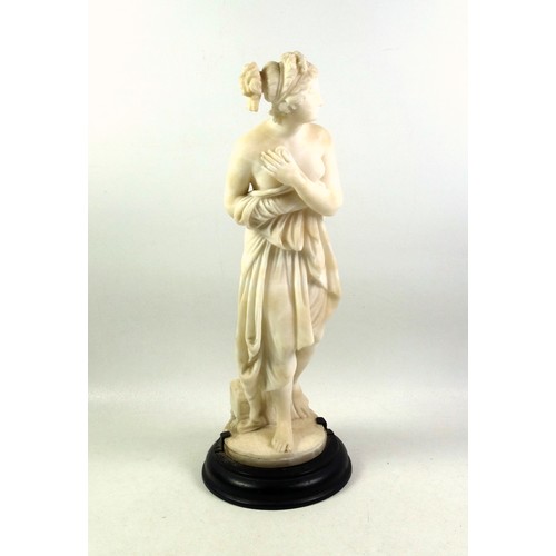 414 - Italian alabaster figure of Pandora, the first woman, standing on a circular base, H.35cm overall, (... 