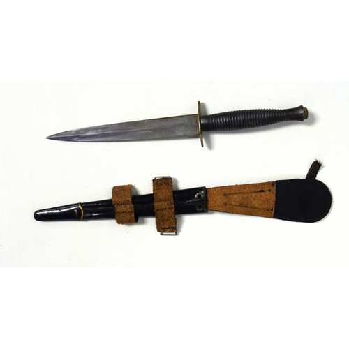 509 - Fairbairn Sykes 3rd pattern Commando knife, black ribbed handle and scabbard with later decoration a... 