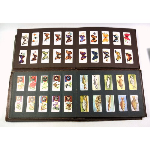 521 - 6 albums containing mainly 1930s Player's Cigarette cards, including 2 sets of cricketers (100), set... 