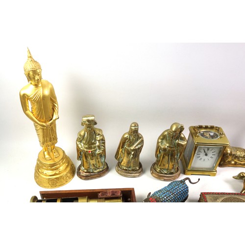 534 - A brass carriage clock and various other brass items to include weighing scales, candle snuffers, a ... 