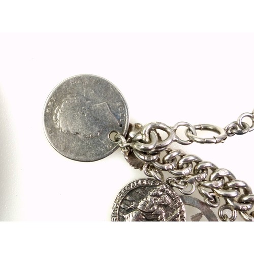 161 - Silver bracelet with a George IV shilling, 1826, George VI 6d, 1943, and 17 charms; Greek key style ... 