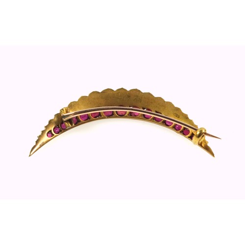 252 - Edwardian gold ruby and pearl set crescent brooch, length 4.2cm, fifteen graduated rubies and twenty... 