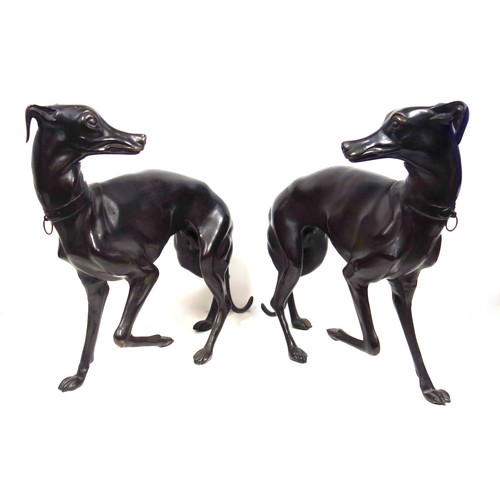 415 - A pair of bronzed sculptures of whippets, 20th century, unsigned, after P J Mene with head turned an... 