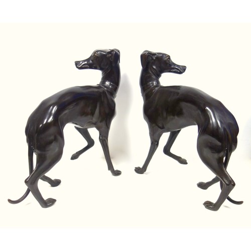 415 - A pair of bronzed sculptures of whippets, 20th century, unsigned, after P J Mene with head turned an... 