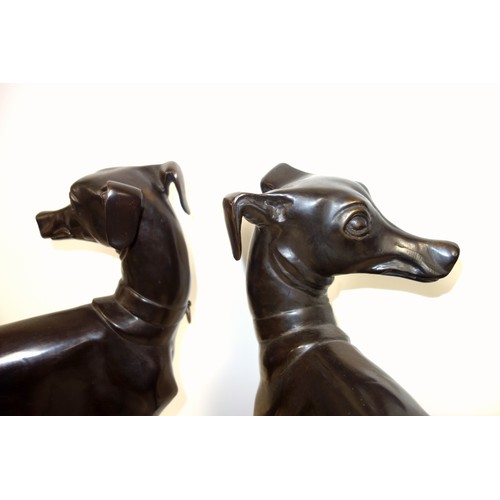 415 - A pair of bronzed sculptures of whippets, 20th century, unsigned, after P J Mene with head turned an... 