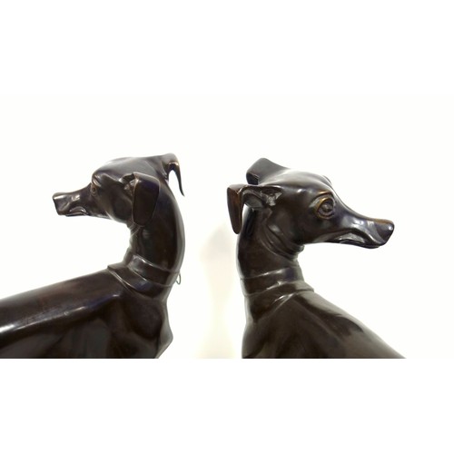 415 - A pair of bronzed sculptures of whippets, 20th century, unsigned, after P J Mene with head turned an... 