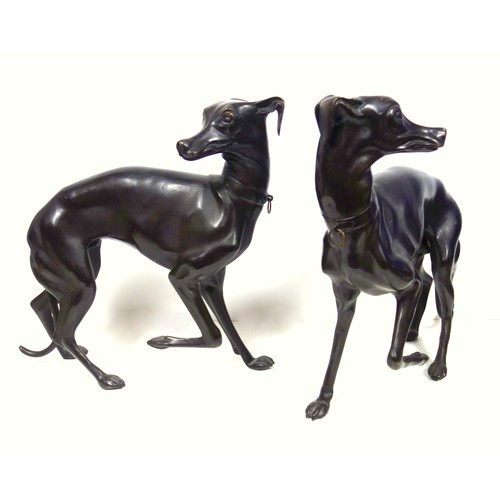 415 - A pair of bronzed sculptures of whippets, 20th century, unsigned, after P J Mene with head turned an... 