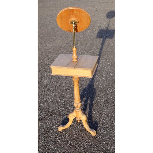 217 - Victorian elm shaving stand with an adjustable round mirror above a storage compartment with double ... 