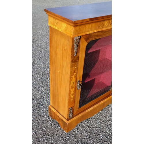 221 - Victorian inlaid walnut pier cabinet, with a glazed panelled door flanked by gilt metal mounts, step... 