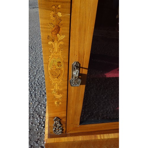 221 - Victorian inlaid walnut pier cabinet, with a glazed panelled door flanked by gilt metal mounts, step... 