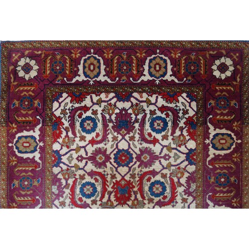 238 - South Caucasian Karabagh rug, the camel-coloured field with all-over herati pattern, within a madder... 