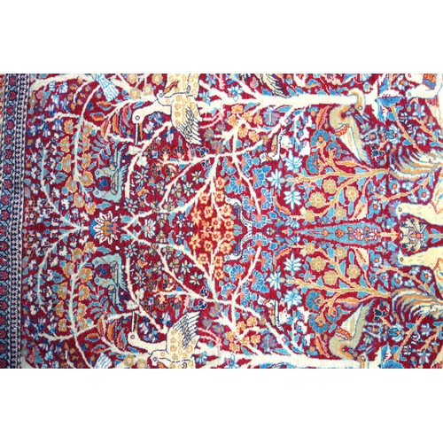 239 - Kashmiri rug, the madder field with all-over 