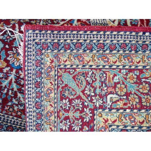 239 - Kashmiri rug, the madder field with all-over 