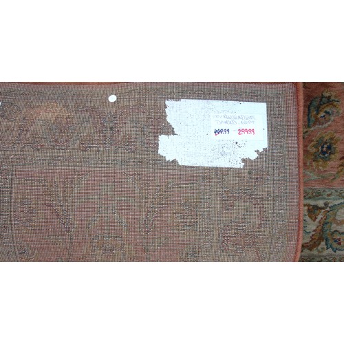 249 - Machine-made rug, the terracotta field with all-over floral decoration, 175 x 118cm, and a pair of m... 