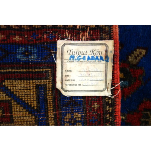 250 - Turkish Yahyali prayer rug, the indigo field with a floral vase beneath 3 lanterns flanked by 2 colu... 