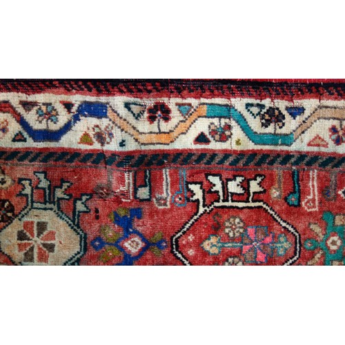 251 - Caucasian Lori Pambak Kazak rug, the abrashed madder field with 3 conjoined serrated medallions, fla... 