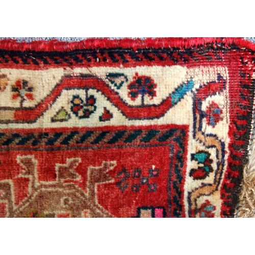 251 - Caucasian Lori Pambak Kazak rug, the abrashed madder field with 3 conjoined serrated medallions, fla... 