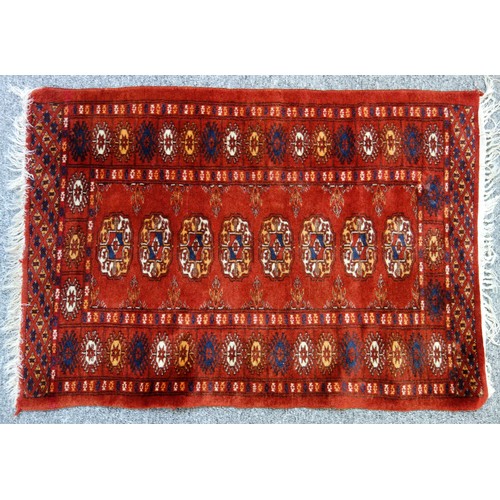 252 - Turkish Malatya rug, the madder field with 2 conjoined medallions, geometric inner medallions, withi... 