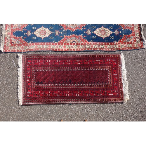 255 - Persian rug, the madder field with all-over geometric pattern, within a floral border and rosette gu... 