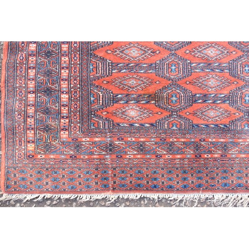 257 - Early 20th Century Turkoman rug, the terracotta field with 3 rows of Tekke guls, Gurbaghe guls inbet... 