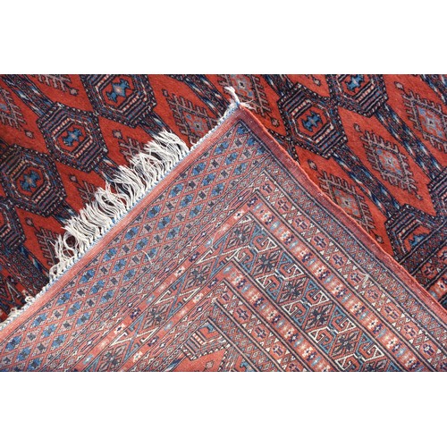 257 - Early 20th Century Turkoman rug, the terracotta field with 3 rows of Tekke guls, Gurbaghe guls inbet... 