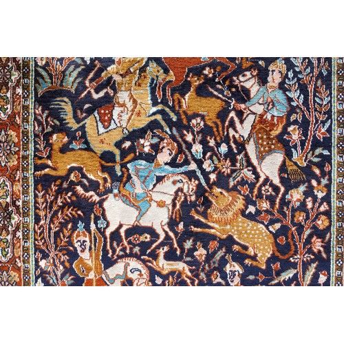 259 - Persian silk rug depicting a hunting scene, the noire field with figures on horseback with hounds hu... 