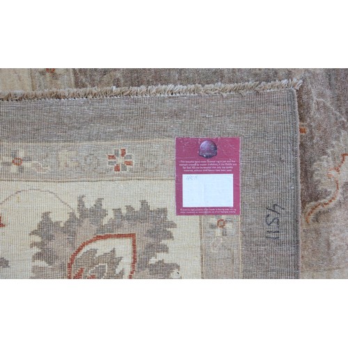 264 - Large Persian carpet, the camel coloured field with all-over palmette decoration, within a similar i... 