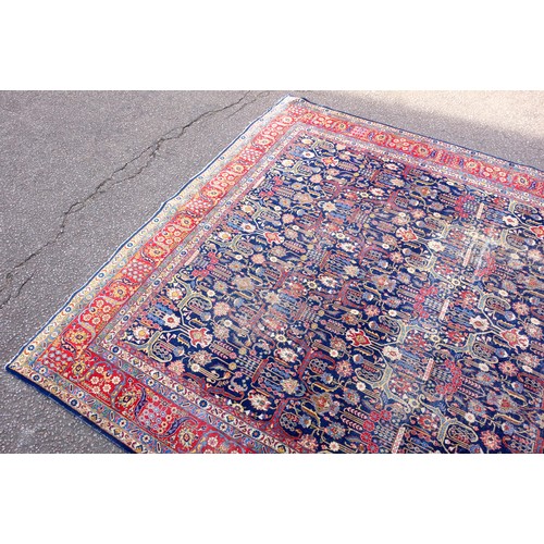 267 - Large Early 20th Century Persian Tabriz carpet, the indigo field with all-over palmette, rosette, an... 