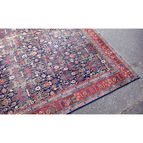 267 - Large Early 20th Century Persian Tabriz carpet, the indigo field with all-over palmette, rosette, an... 