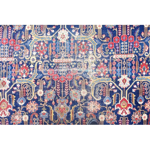 267 - Large Early 20th Century Persian Tabriz carpet, the indigo field with all-over palmette, rosette, an... 