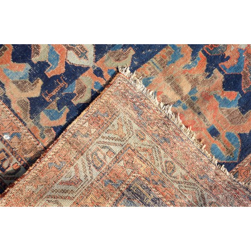 272 - Early 20th Century Caucasian rug, the indigo field with rows of palmette decoration, within an ivory... 