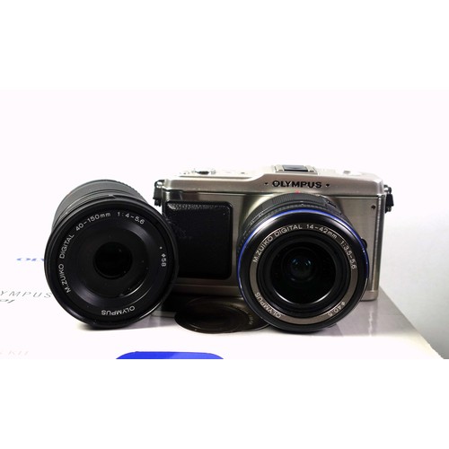 288 - 2 Digital Mirrorless cameras, Olympus Pen EP1, and a Panasonic GF1, (body only), both boxed, and 2 O... 