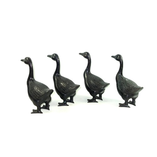 283 - Set of 4 bronze models of ducks, standing, H.22.5cm. (4)