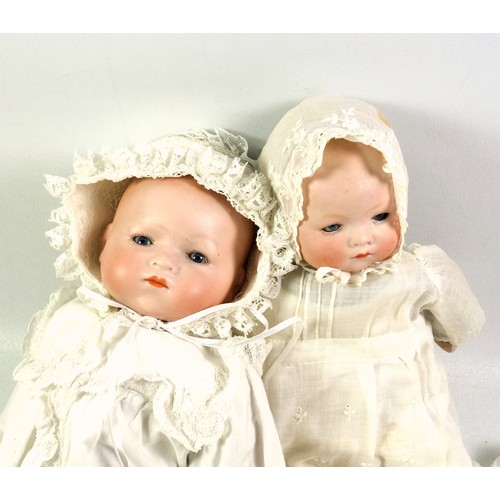 328 - Two Armand Marseille German bisque headed baby dolls, 'AM' mark to the back of the neck, with cloth ... 