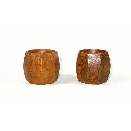 347 - Pair of Mouseman, (Robert Thompson of Kilburn), carved oak napkin rings, each octagonal and with tra... 