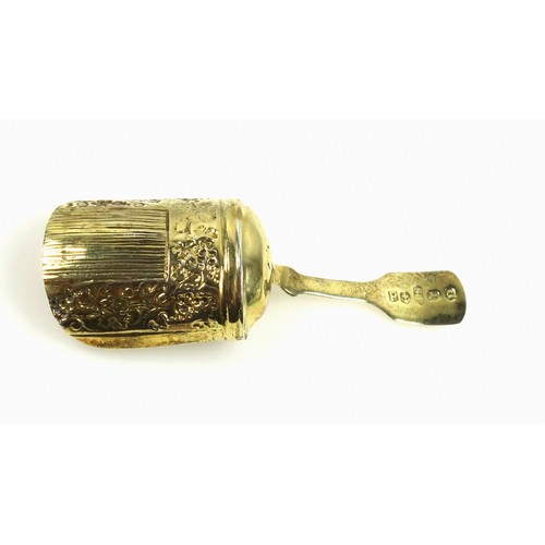 450 - George III silver gilt Fiddle Pattern caddy spoon with a fruiting vine embossed scuttle bowl, by Sam... 