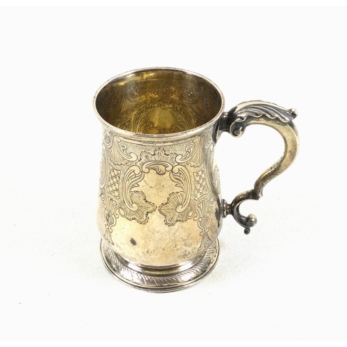 463 - George III silver baluster mug with a twin scroll handle and foliate thumbpiece, gilt interior, and ... 