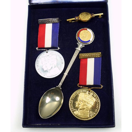 479 - Pair of George VI silver commemorative Coronation caddy spoons, each with a blue enamelled terminal ... 