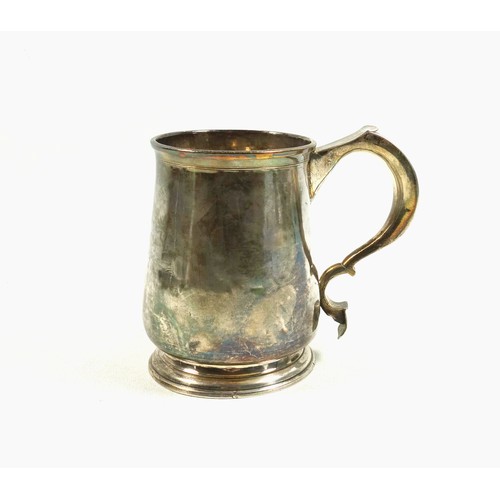 492 - George I provincial silver mug of tapering cylindrical form with a flared rim, wide double scroll ha... 