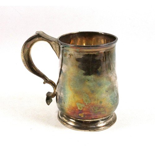 492 - George I provincial silver mug of tapering cylindrical form with a flared rim, wide double scroll ha... 