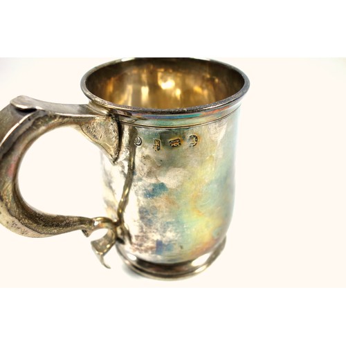 492 - George I provincial silver mug of tapering cylindrical form with a flared rim, wide double scroll ha... 